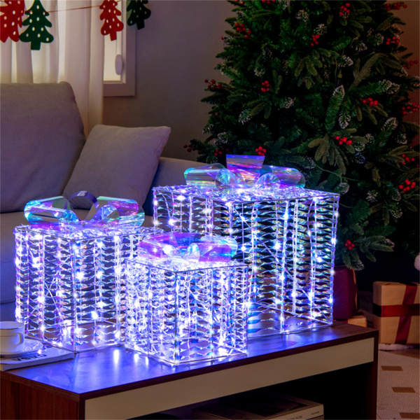 3 glowing Christmas gift boxes with bows