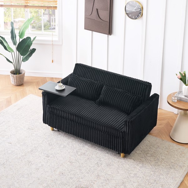 The pull-out and push-in black corduroy sofa with dual functions, equipped with a movable tabletop and USB ports, is suitable for use in living rooms and bedrooms.